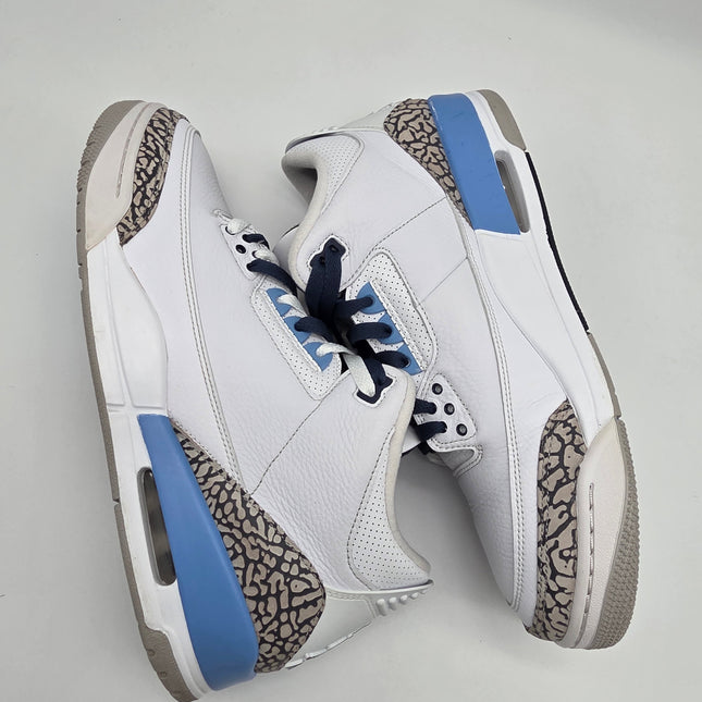 White sneakers with blue accents on a gray background